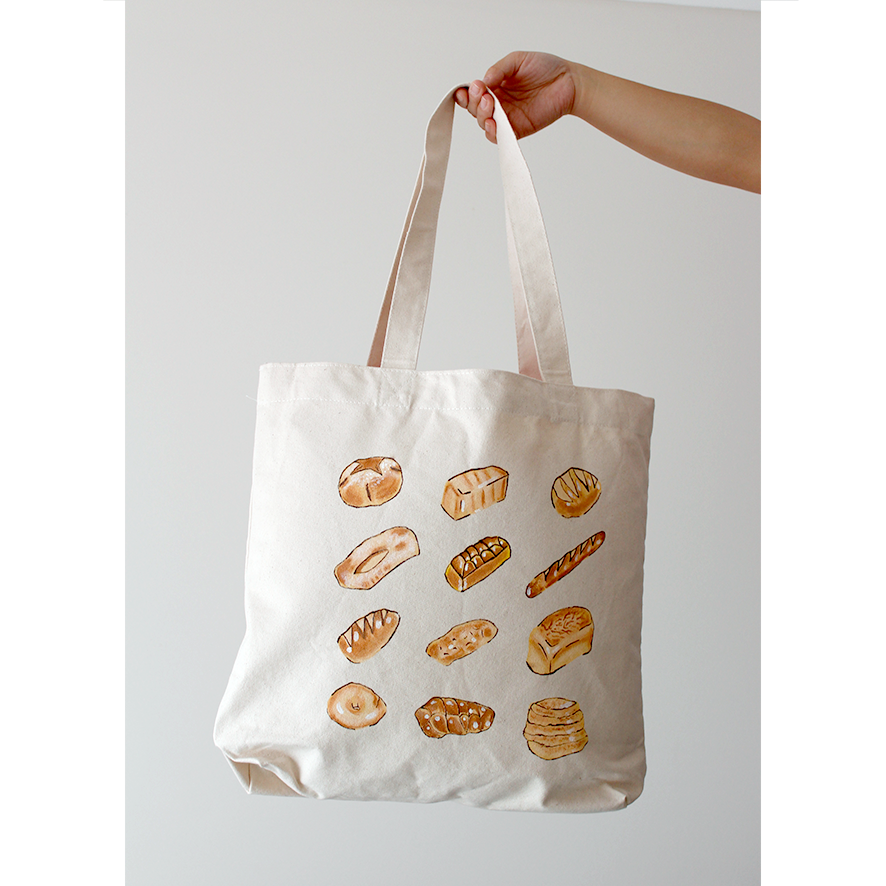 12 different bread loaves hand-painted on a natural beige cotton canvas bag