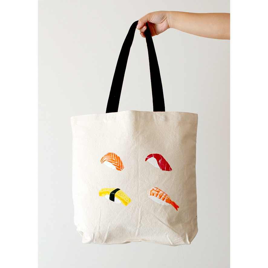 Salmon nigiri, tuna, egg and prawn sushi hand-painted on a natural beige cotton canvas bag