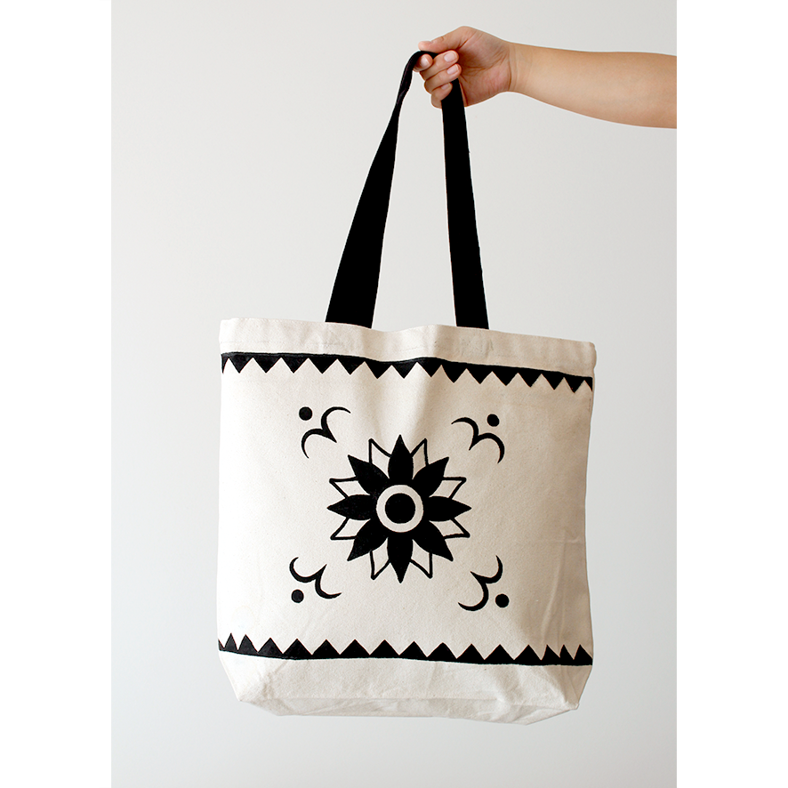 Flower pattern tribal art in black hand-painted a cotton natural beige tote bag