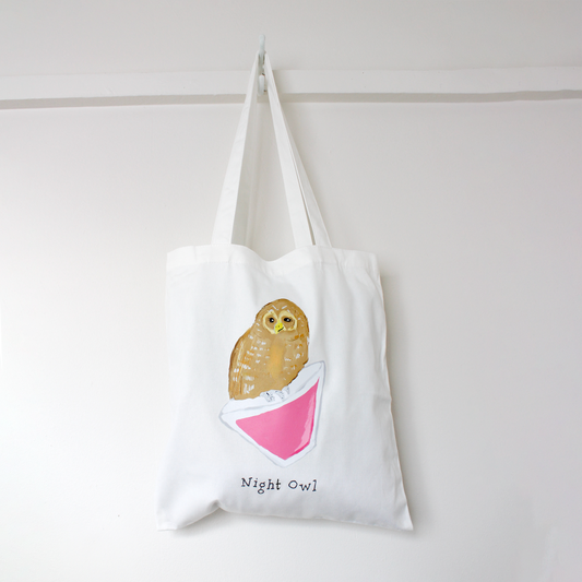 White tote bag with an owl design and 'Night Owl' text on a white background