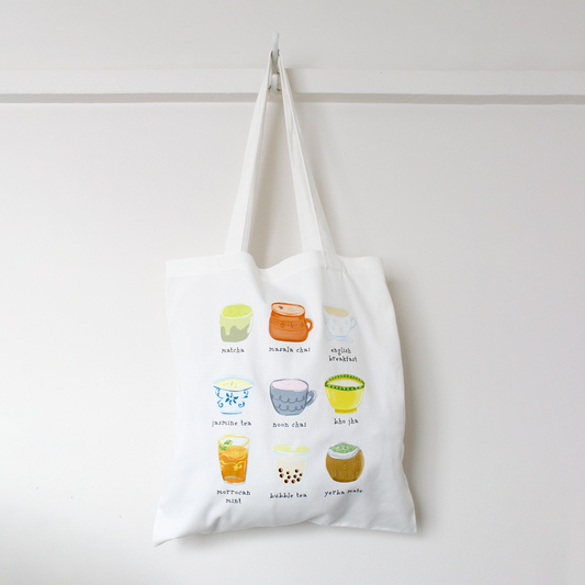 Tote bag with colorful illustrations of various teas from around the world on a white background